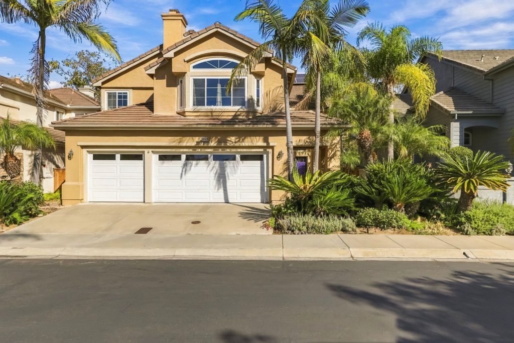 Front exterior of 5488 Caminito Exquisito with 3-car garage